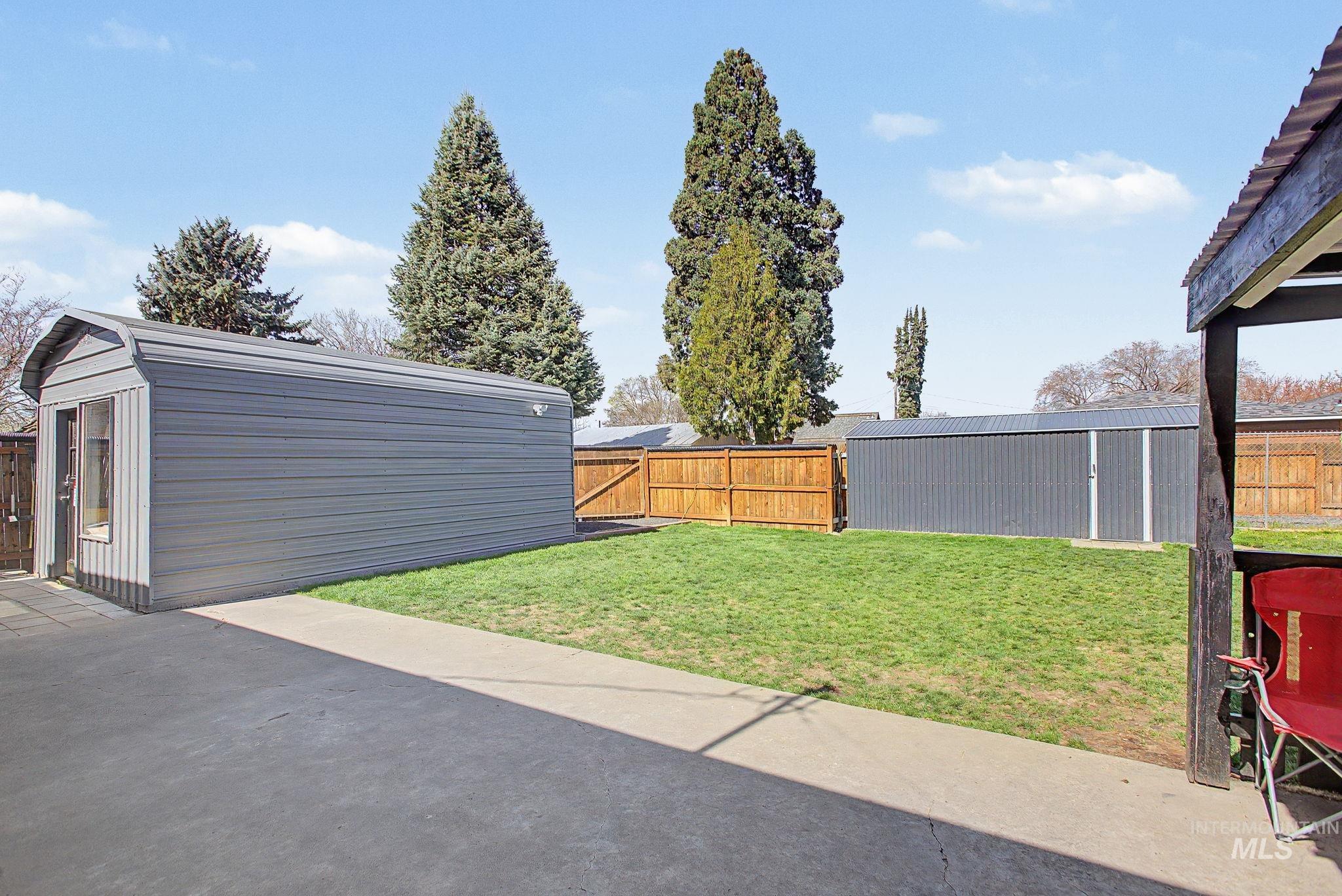 809 Bryden Avenue Lewiston, ID 83501 - Photo 36 of 42 Fenced backyard featuring an outdoor structure and a patio area