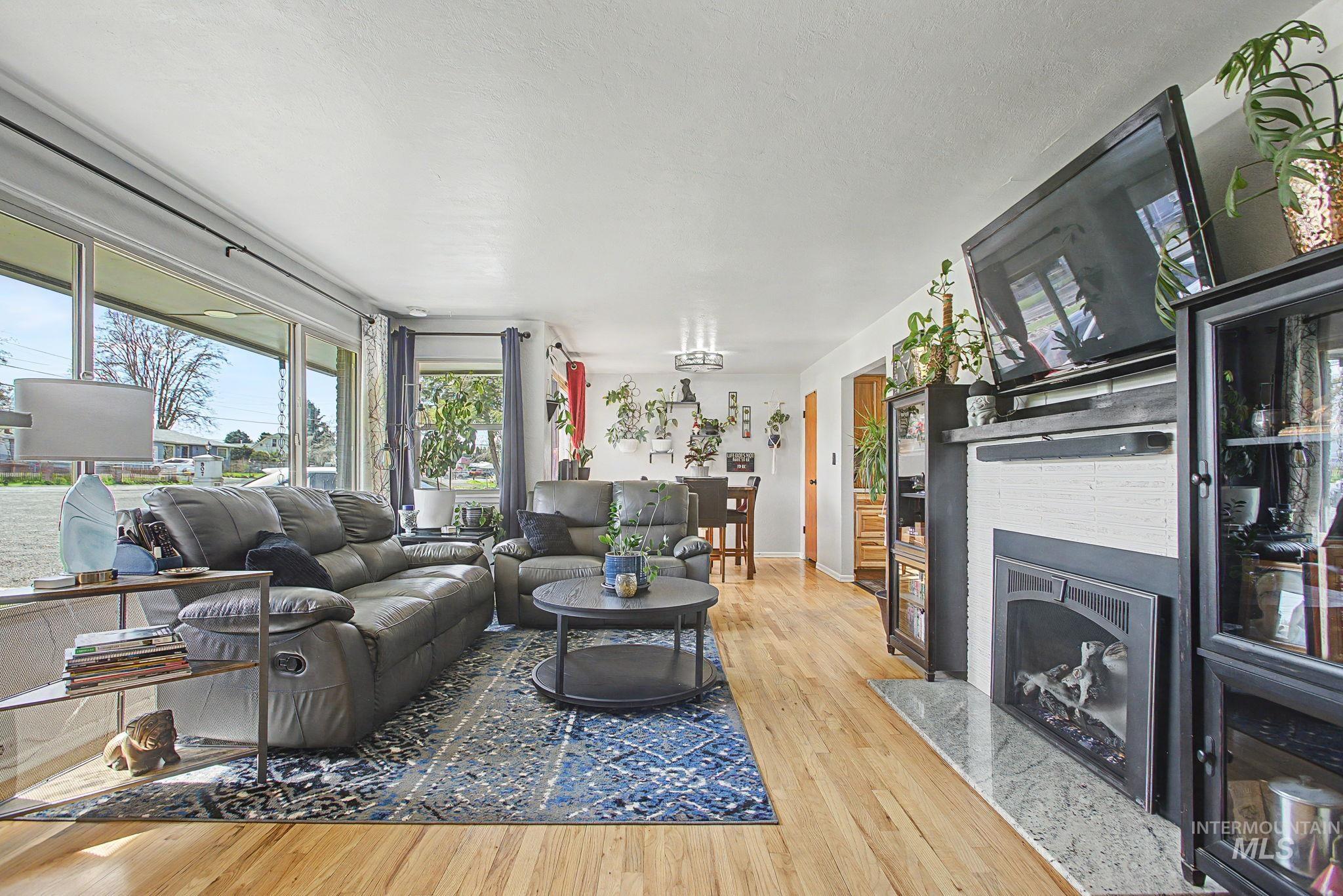 809 Bryden Avenue Lewiston, ID 83501 - Photo 7 of 42 Living area with light wood finished floors and a high end fireplace