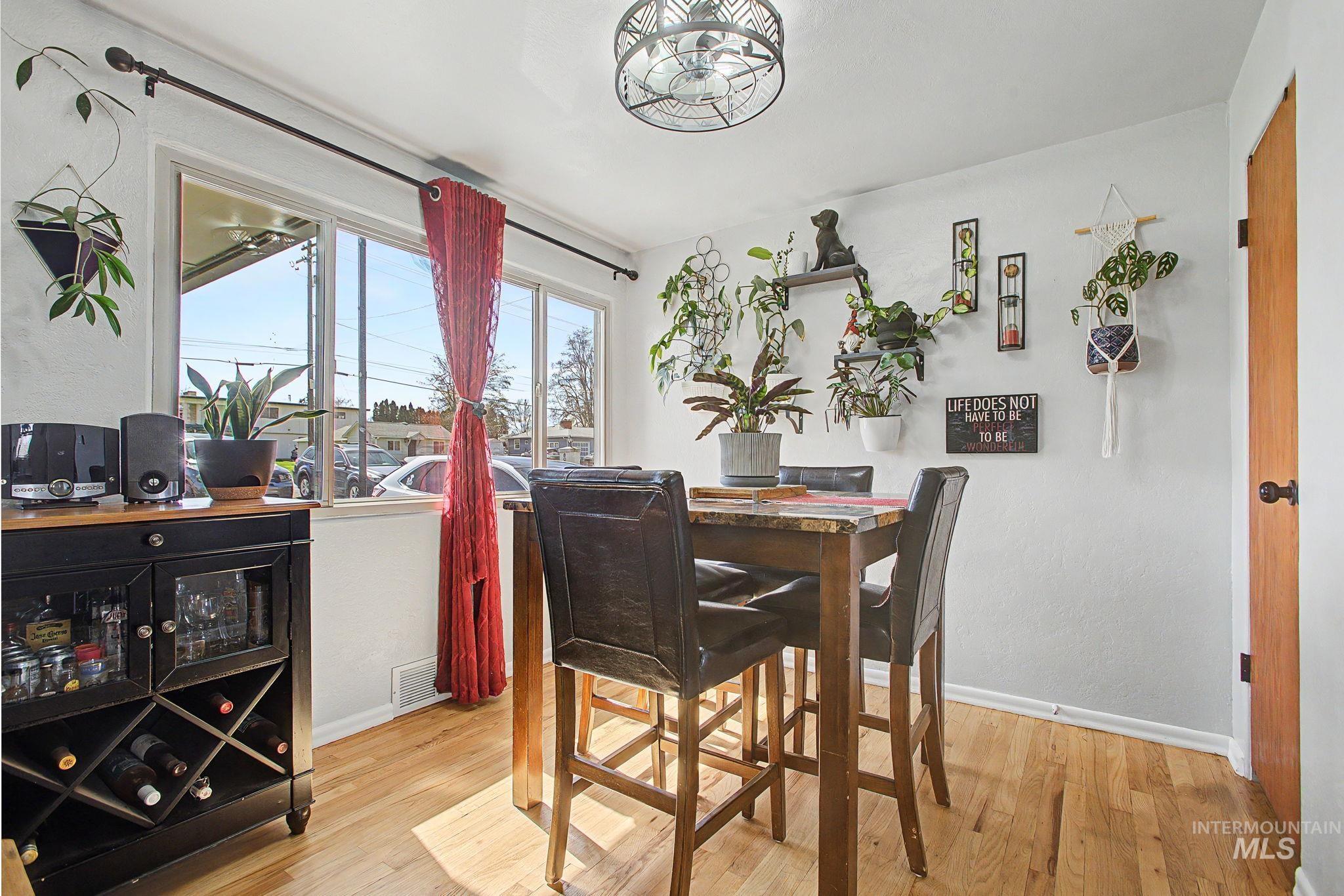 809 Bryden Avenue Lewiston, ID 83501 - Photo 9 of 42 Dining space with baseboards and light wood-style flooring