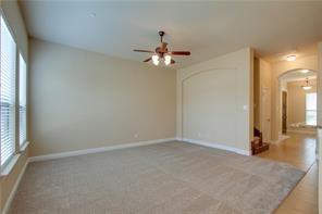 4679 Edith Street Plano, TX 75024 - Photo 13 of 34 Spacious living area featuring neutral carpeting and vaulted ceilings