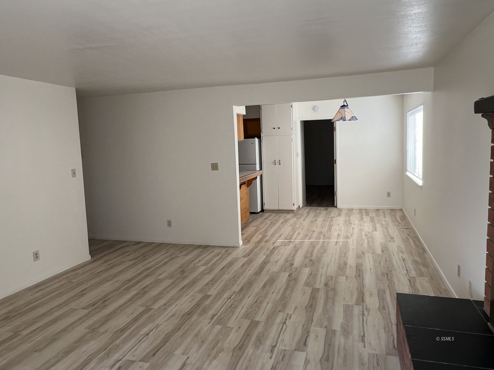 209 South Gold Canyon Street Ridgecrest, CA 93555 - Photo 3 of 33 a view of hallway with wooden floor