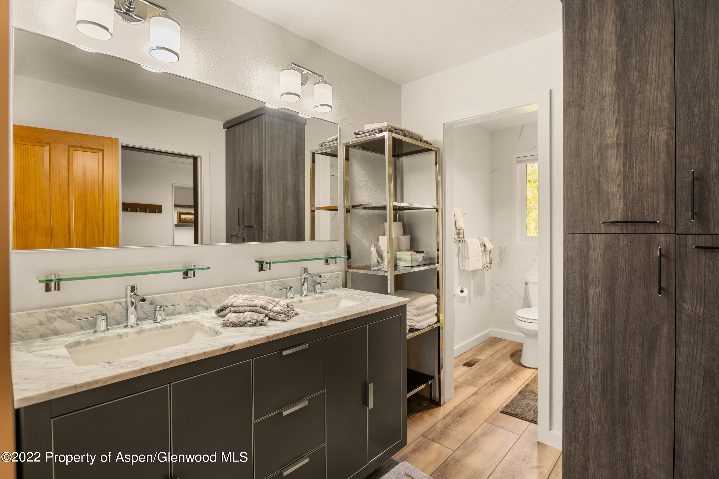 144 Meadow Road Snowmass Village, CO 81615 - Photo 11 of 25 a bathroom with a sink a toilet and shower
