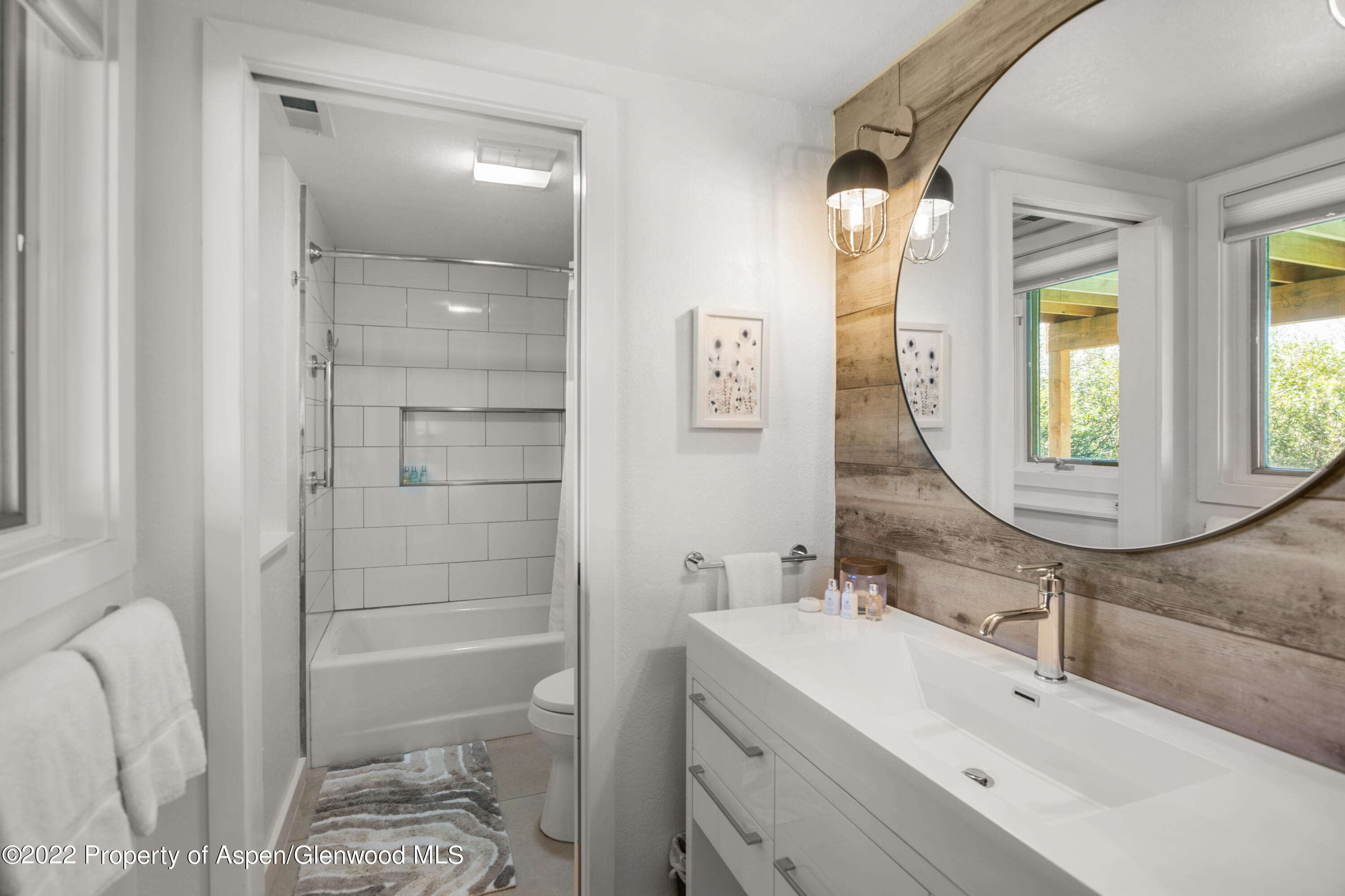 144 Meadow Road Snowmass Village, CO 81615 - Photo 12 of 25 a bathroom with a sink and a mirror