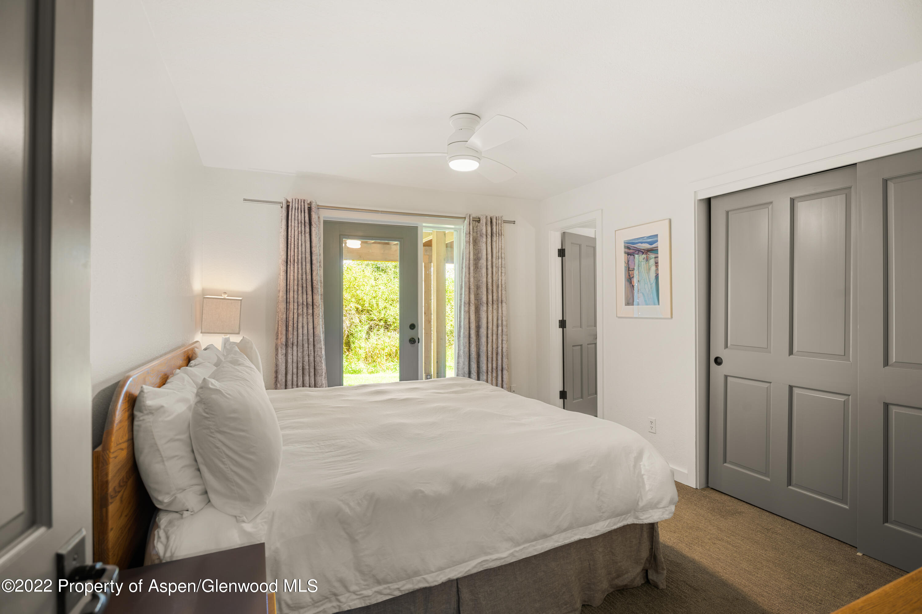 144 Meadow Road Snowmass Village, CO 81615 - Photo 13 of 25 a large bed sitting in a bedroom and closet