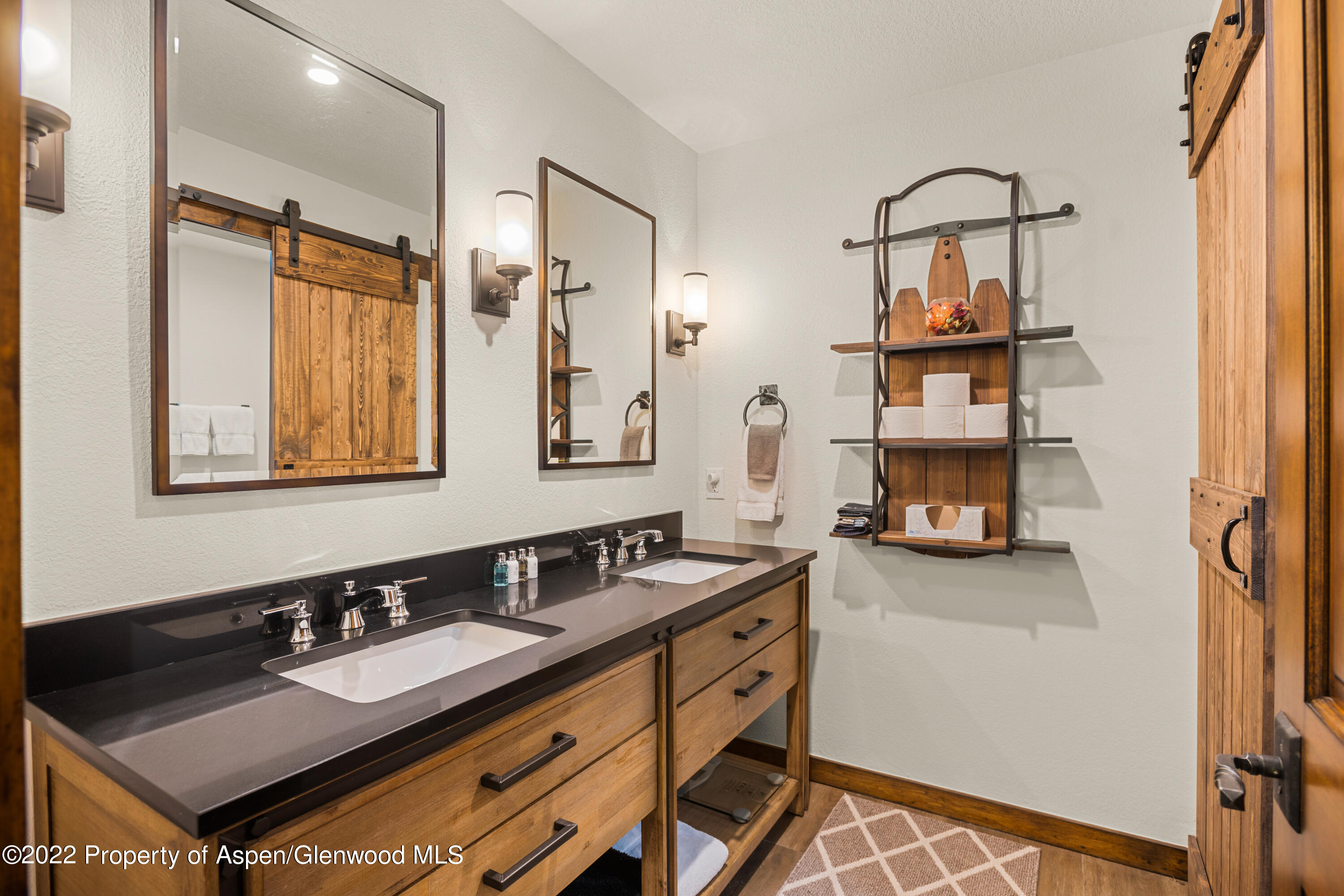 144 Meadow Road Snowmass Village, CO 81615 - Photo 18 of 25 a bathroom with a sink and a mirror
