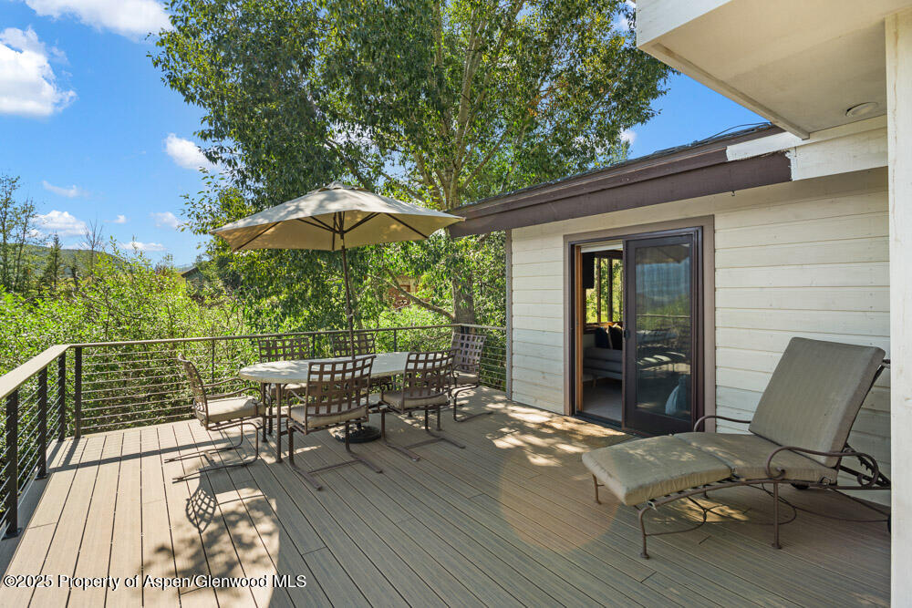 144 Meadow Road Snowmass Village, CO 81615 - Photo 23 of 25 a view of a chairs and table on the wooden floor