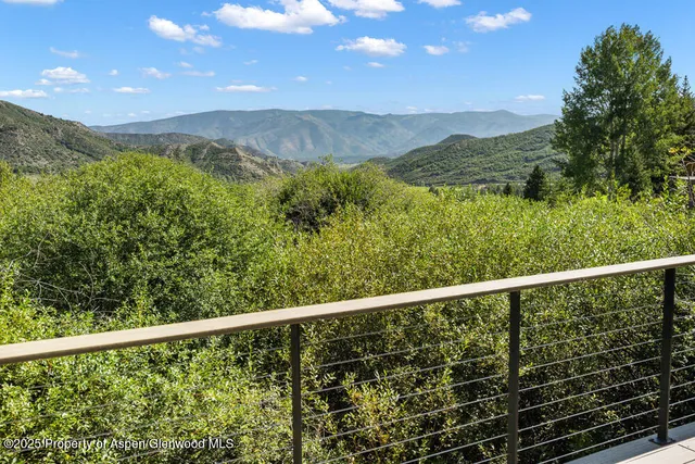 a view of a balcony with an outdoor space