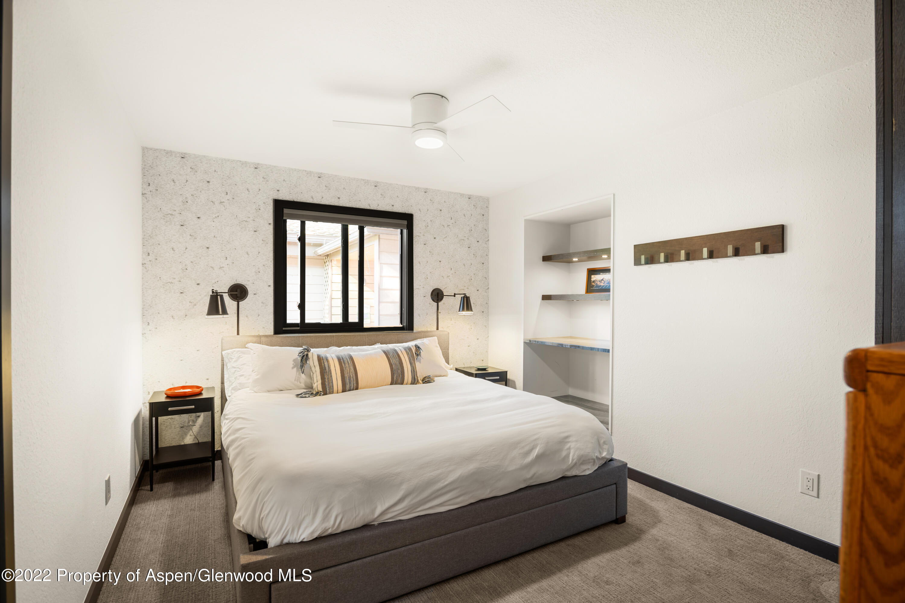 144 Meadow Road Snowmass Village, CO 81615 - Photo 10 of 25 a bedroom with a bed and a window