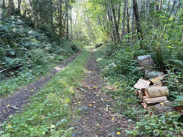 a backyard of a house with outdoor seating