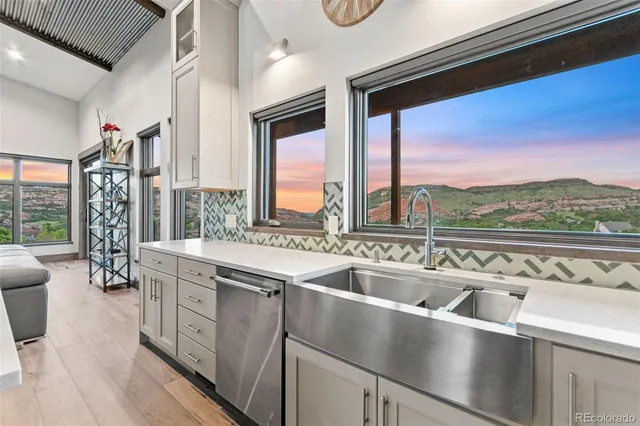 a view of a kitchen with a large window