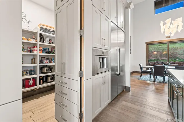 a view of kitchen and entryway with wooden floor