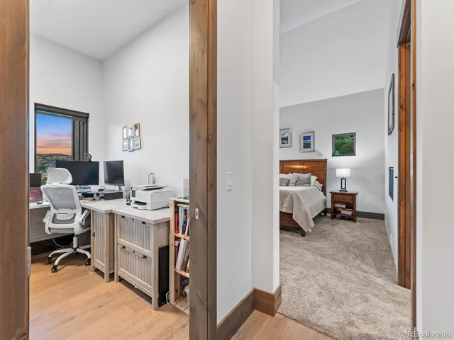 a view of a bedroom with a workspace