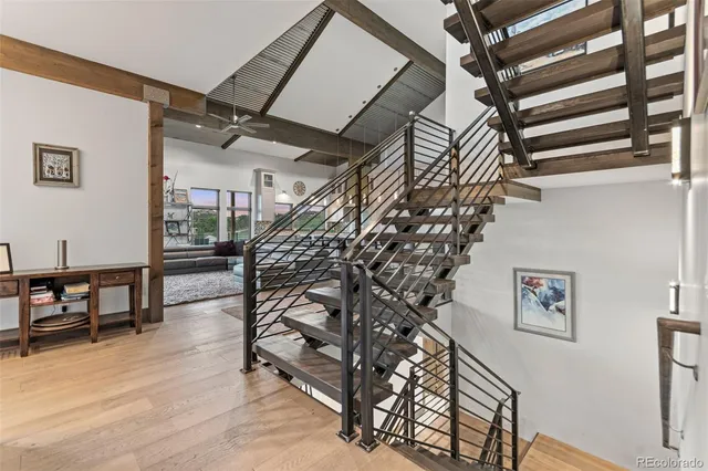 a view of entryway with stairs and a chandelier