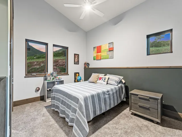 a bedroom with a bed and a table