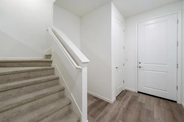 a kitchen with a sink a refrigerator and a stove top oven