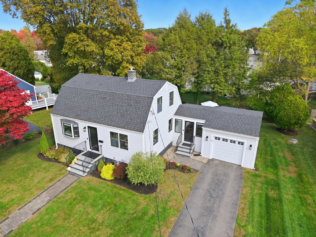 16 Beebe Lane Wakefield, MA 01880 - Photo 1 of 32 a aerial view of a house next to a big yard and large trees