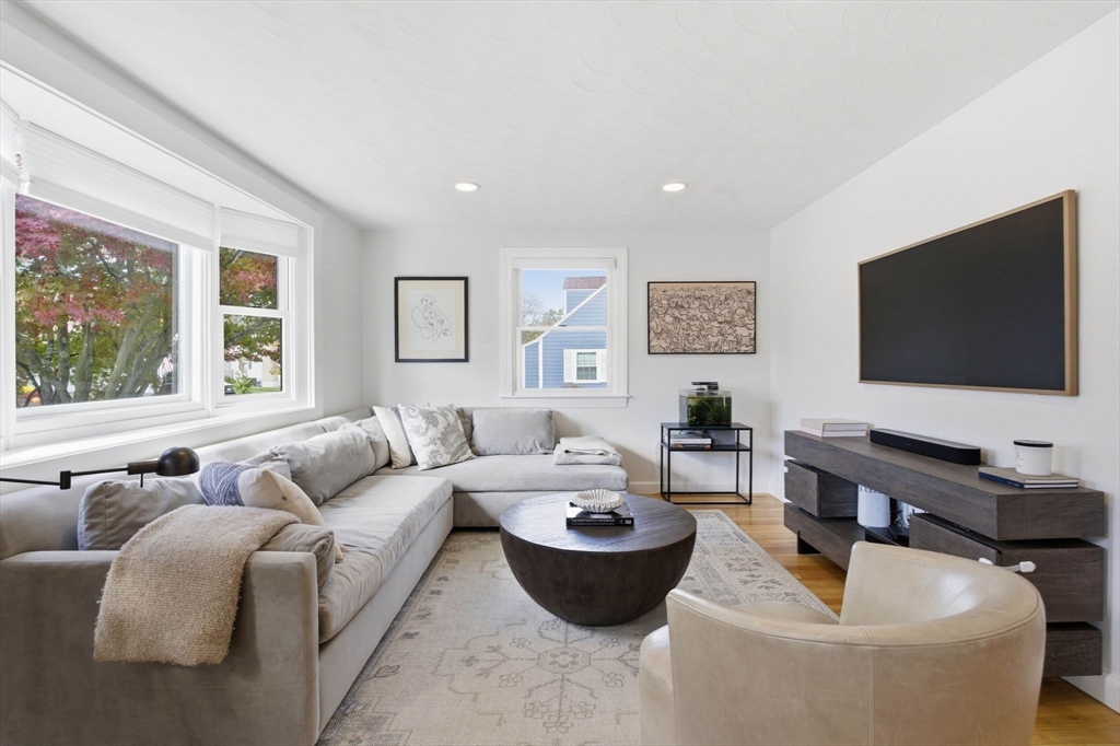 16 Beebe Lane Wakefield, MA 01880 - Photo 13 of 32 a living room with furniture and a flat screen tv