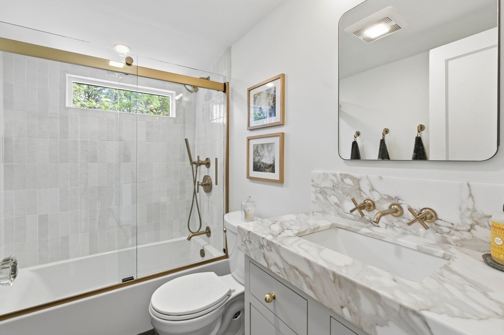16 Beebe Lane Wakefield, MA 01880 - Photo 19 of 32 a bathroom with a granite countertop sink toilet and shower