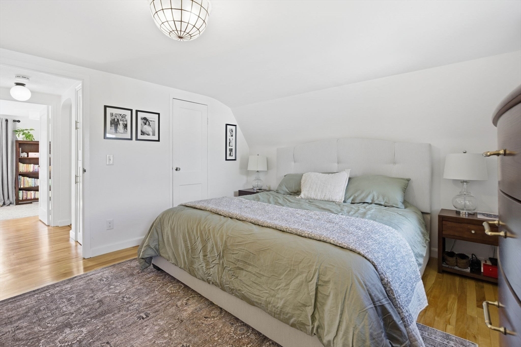 16 Beebe Lane Wakefield, MA 01880 - Photo 21 of 32 a spacious bedroom with a bed and a table