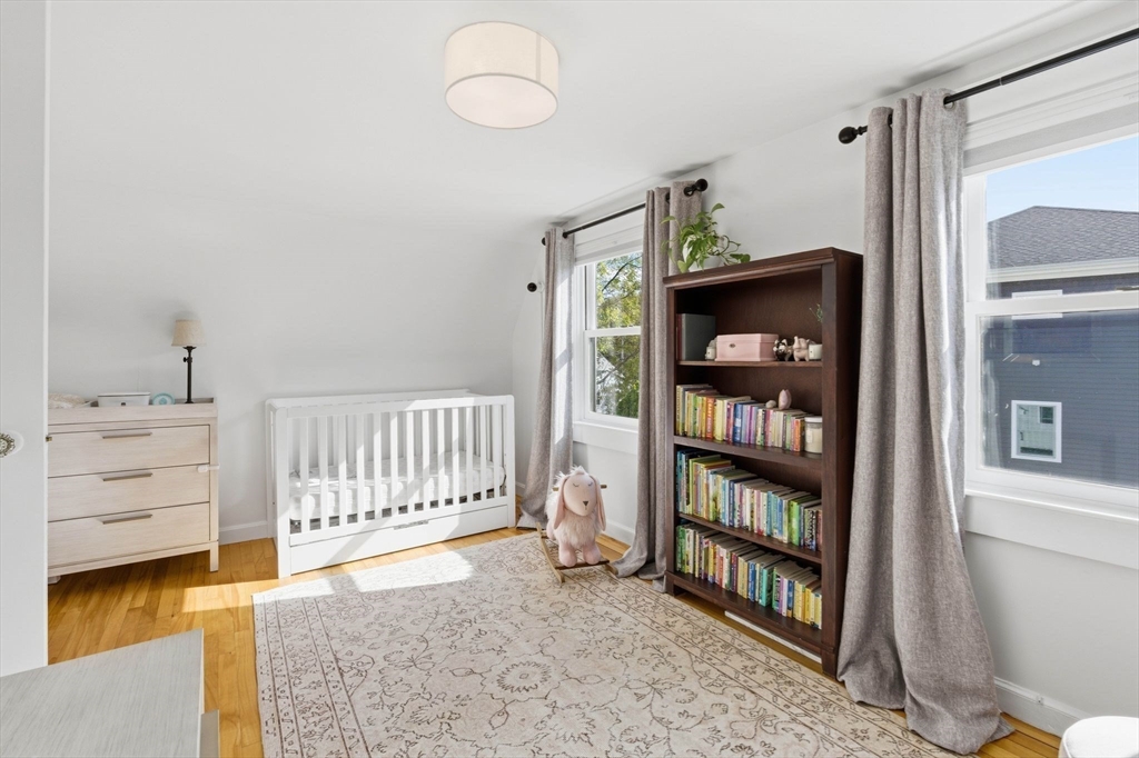 16 Beebe Lane Wakefield, MA 01880 - Photo 24 of 32 a view of a bedroom with racks on the wall