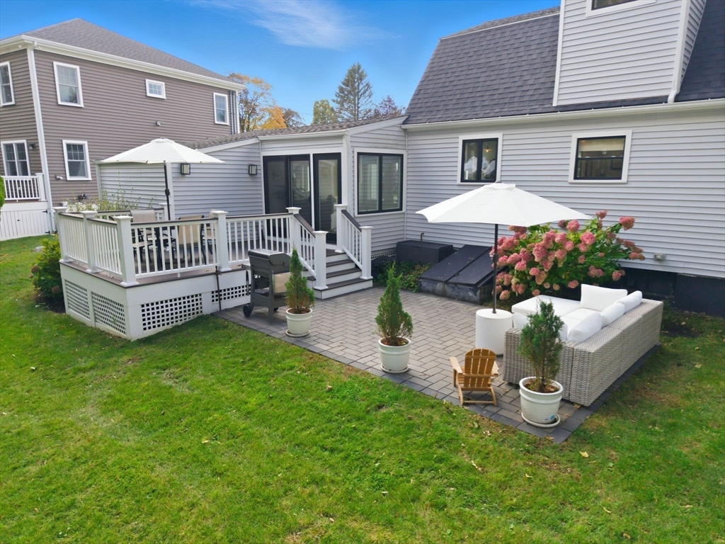 16 Beebe Lane Wakefield, MA 01880 - Photo 25 of 32 a view of a house with a yard and furniture