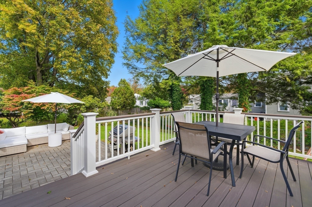 16 Beebe Lane Wakefield, MA 01880 - Photo 27 of 32 a view of a deck with furniture and umbrella