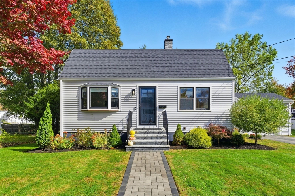 16 Beebe Lane Wakefield, MA 01880 - Photo 32 of 32 a front view of a house with a garden