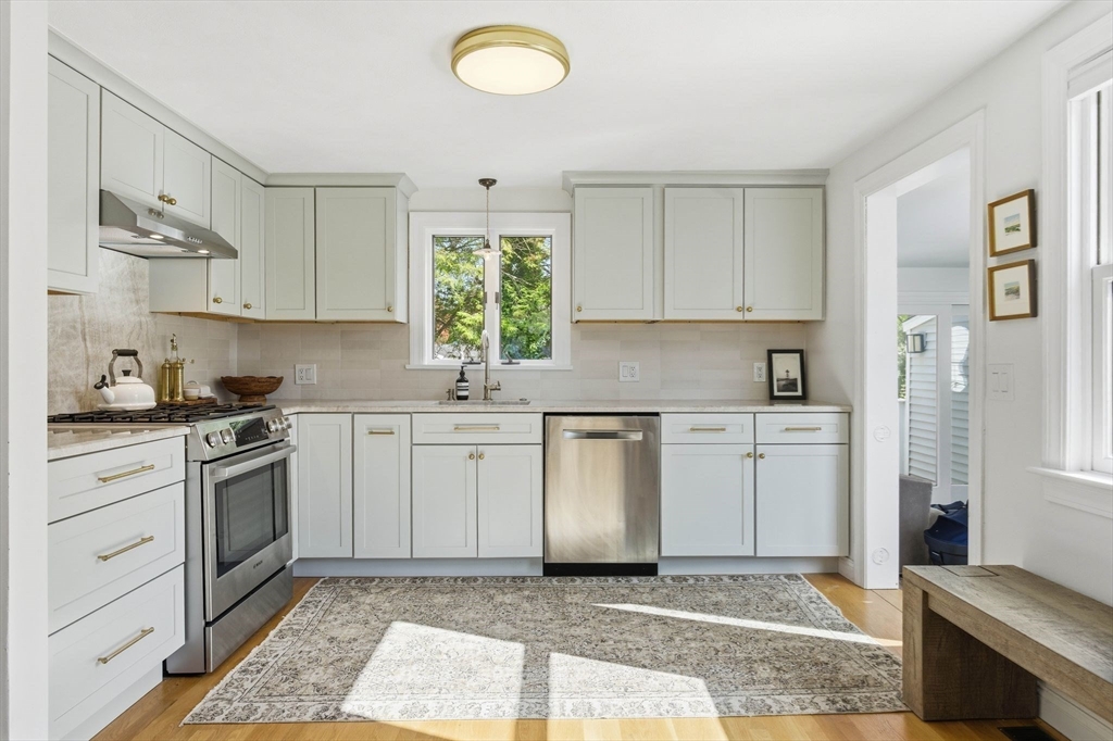 16 Beebe Lane Wakefield, MA 01880 - Photo 4 of 32 a kitchen with a sink stove and cabinets