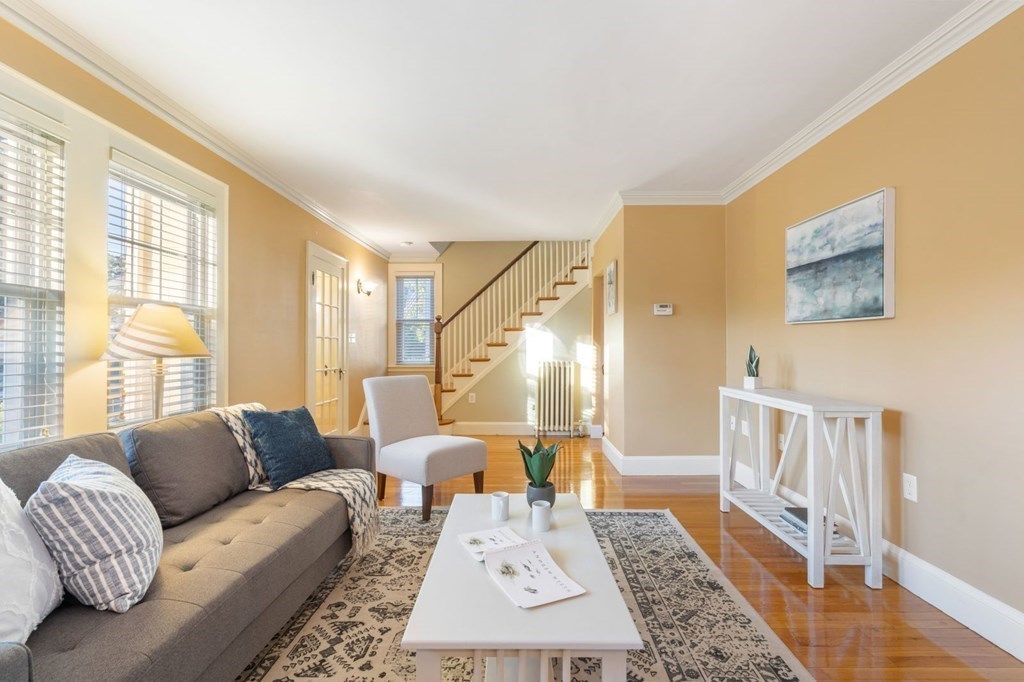 21 Laird Road Medford, MA 02155 - Photo 3 of 32 a living room with furniture and a rug