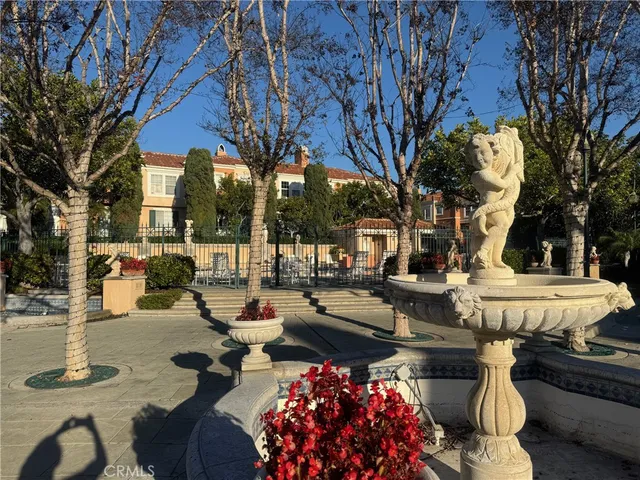 a view of a patio with couches table and chairs and potted plants