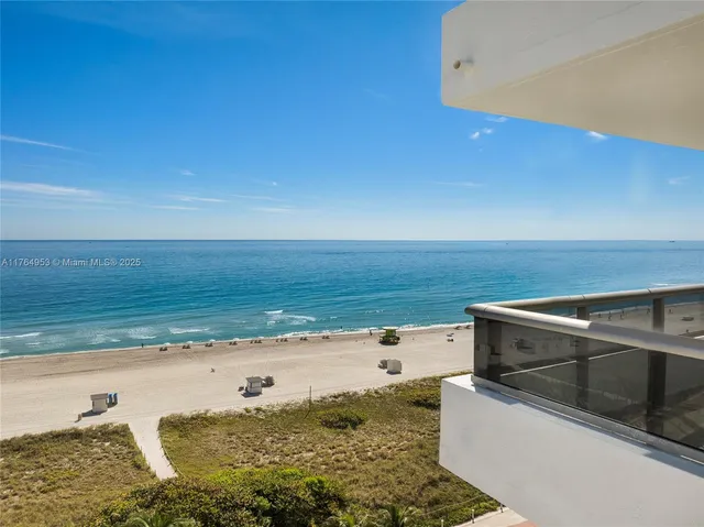 a view of kitchen and an empty room