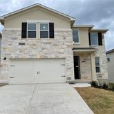 a front view of a house with garage