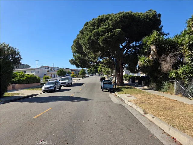 a view of car parked on the side of the road