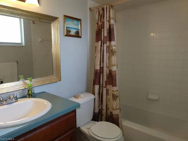 a kitchen with granite countertop a sink and a window