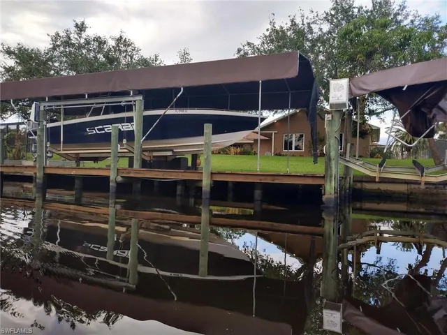 a view of a house with a garage and a balcony