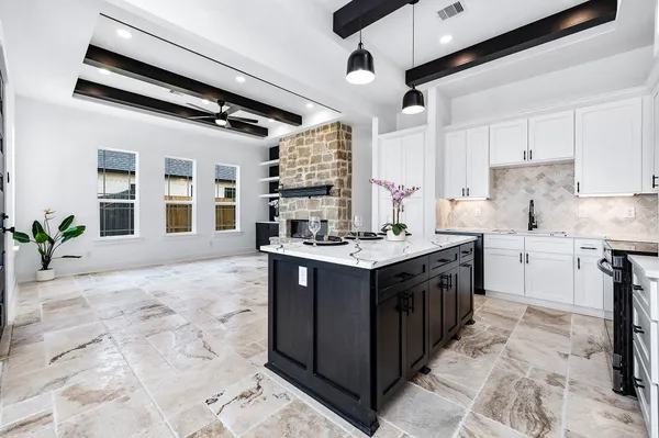 a kitchen with a sink stove and cabinets