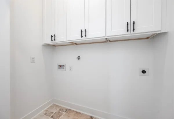 a bathroom with a sink and cabinets