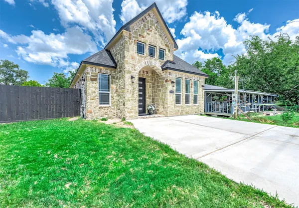 front view of a house with a yard