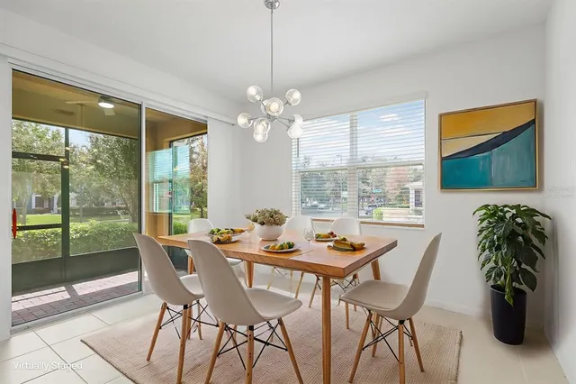 a dining room with furniture window and outside view