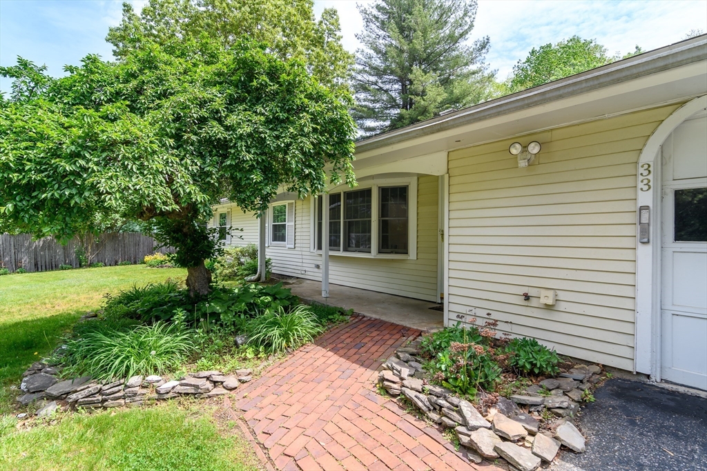 33 Eisenhower Road Framingham, MA 01701 - Photo 2 of 20 a front view of a house with garden