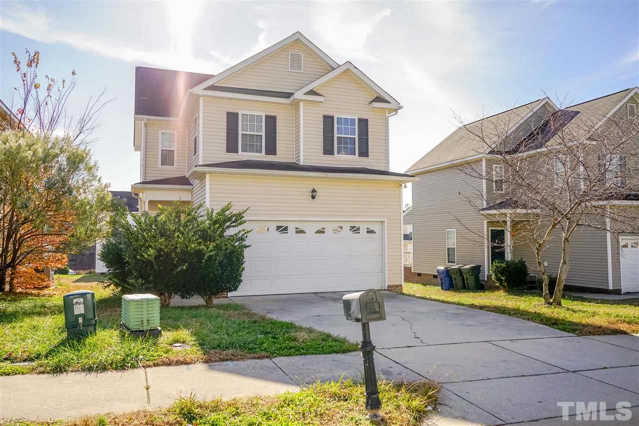 4232 Beacon Crest Way Raleigh, NC 27604 - Photo 1 of 25 a front view of a house with garden