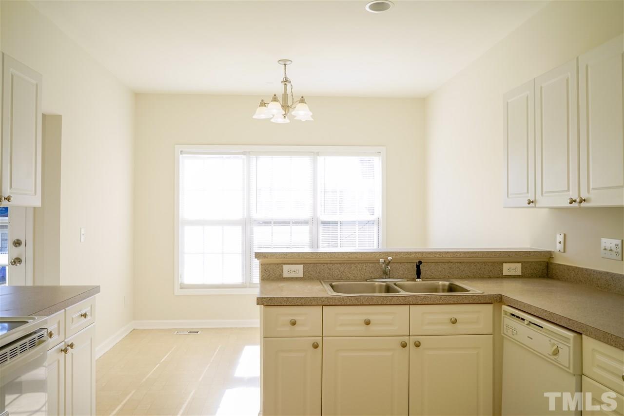 4232 Beacon Crest Way Raleigh, NC 27604 - Photo 12 of 25 a view of a sink cabinets and window