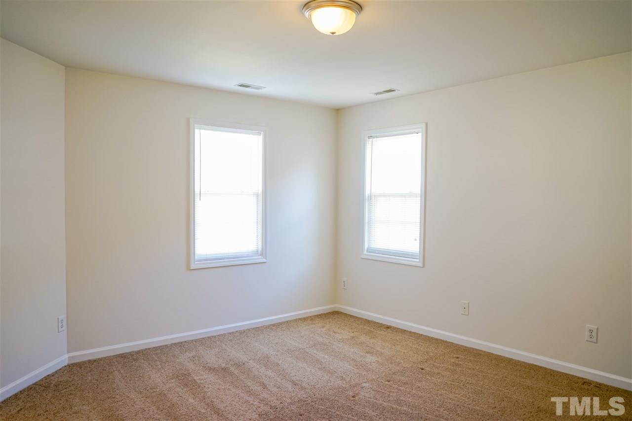4232 Beacon Crest Way Raleigh, NC 27604 - Photo 15 of 25 an empty room with a window