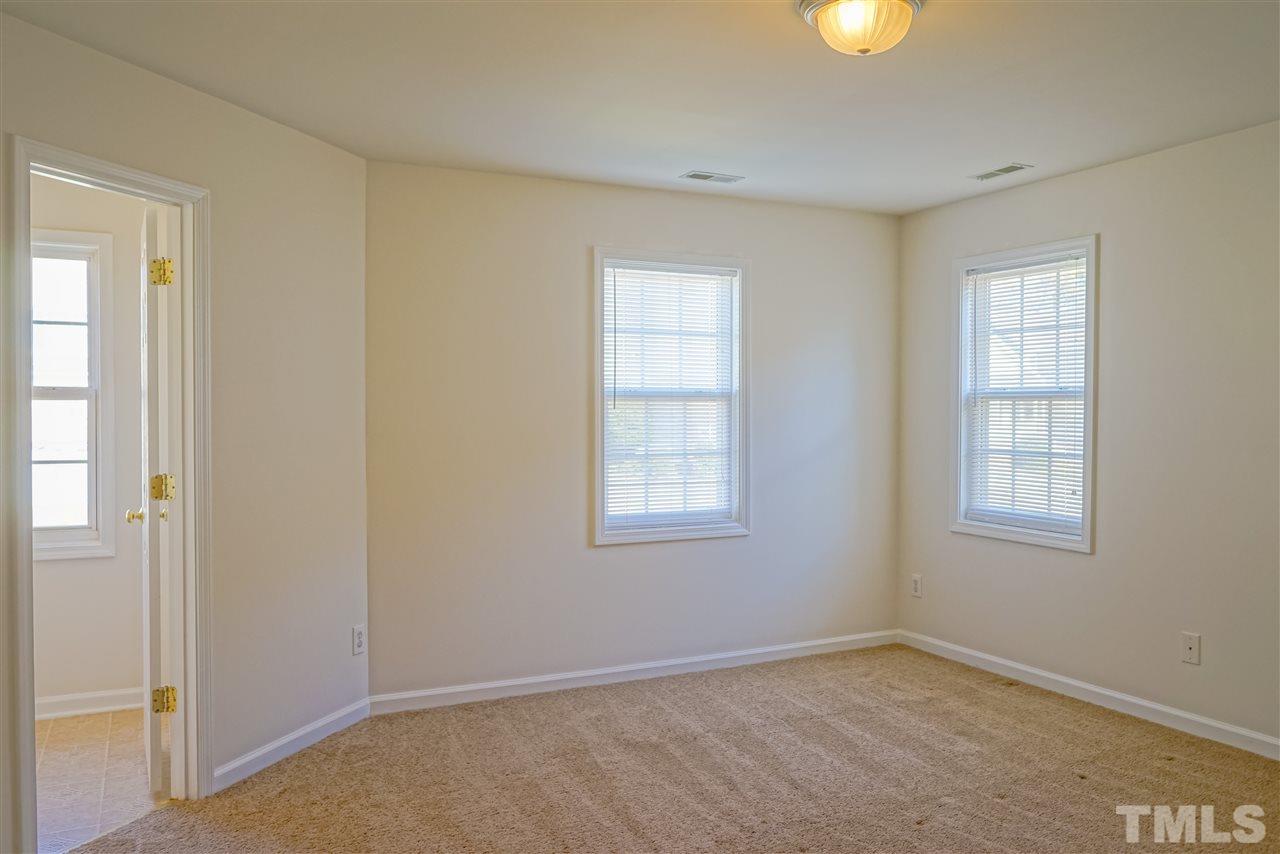 4232 Beacon Crest Way Raleigh, NC 27604 - Photo 17 of 25 an empty room with windows