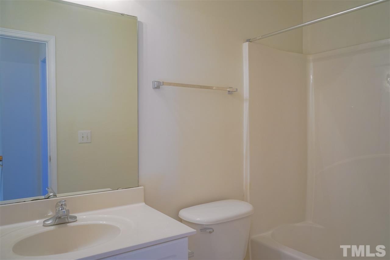 4232 Beacon Crest Way Raleigh, NC 27604 - Photo 20 of 25 a bathroom with a sink and a toilet