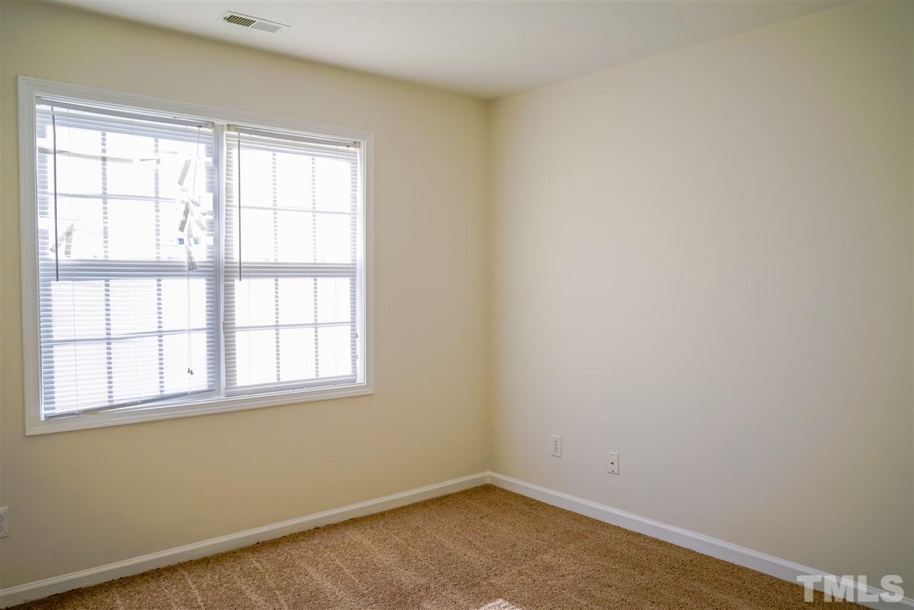 4232 Beacon Crest Way Raleigh, NC 27604 - Photo 22 of 25 an empty room with a window