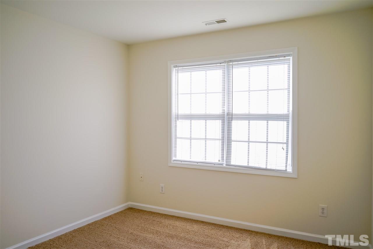 4232 Beacon Crest Way Raleigh, NC 27604 - Photo 23 of 25 an empty room with a window