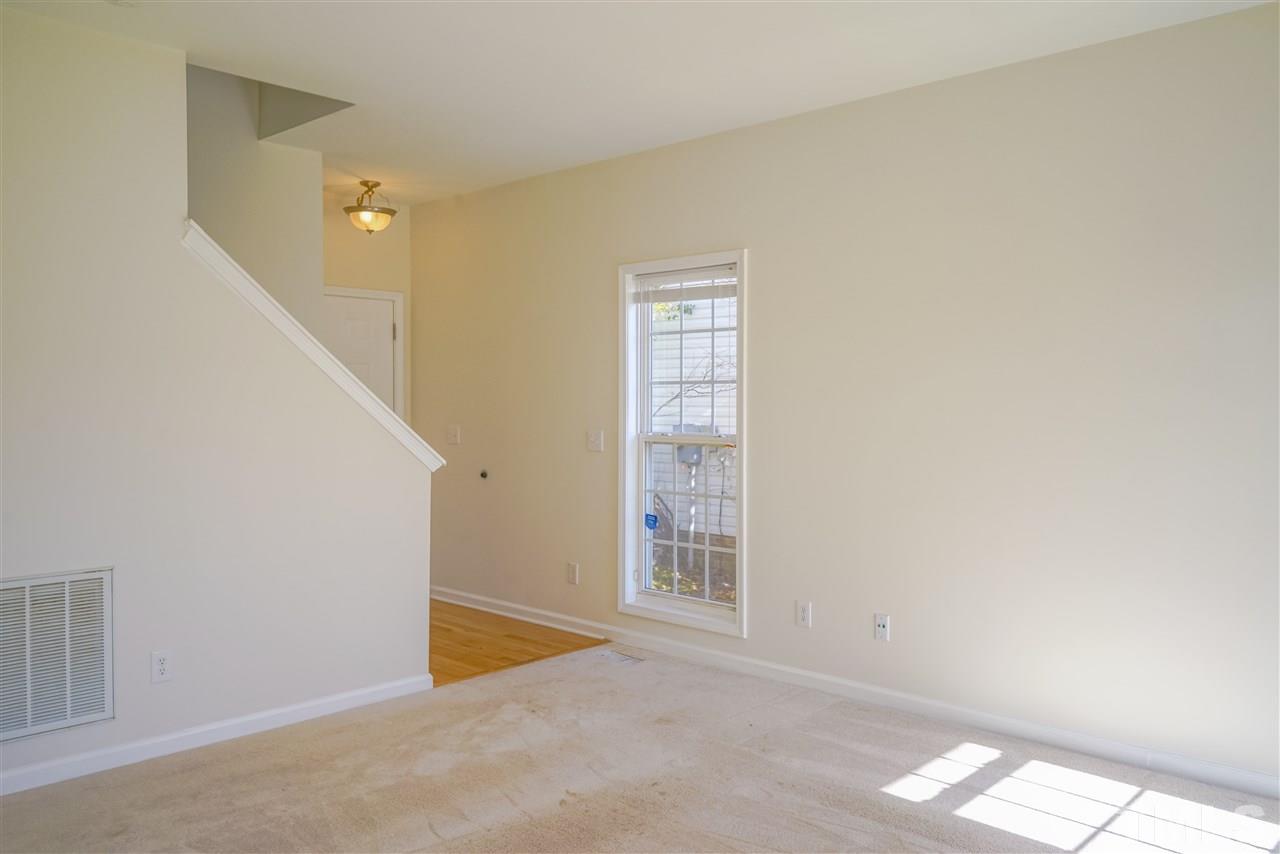 4232 Beacon Crest Way Raleigh, NC 27604 - Photo 7 of 25 a view of an empty room with windows