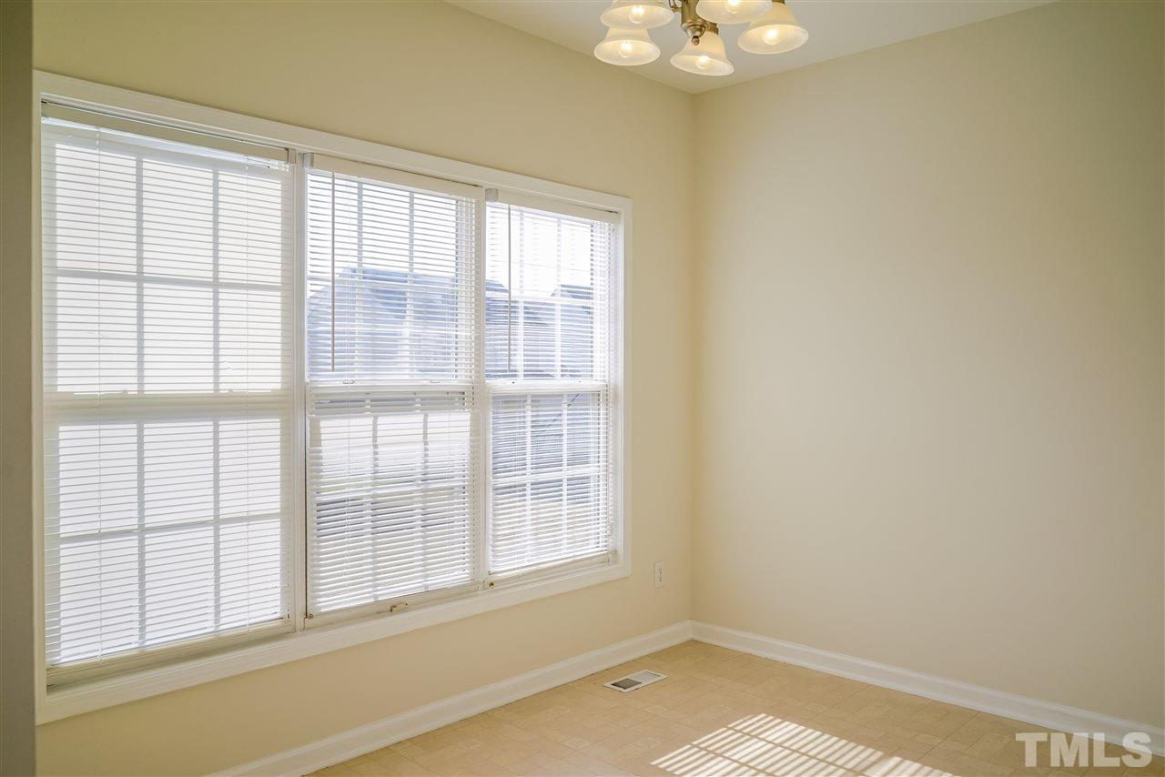 4232 Beacon Crest Way Raleigh, NC 27604 - Photo 8 of 25 a view of an empty room with a window