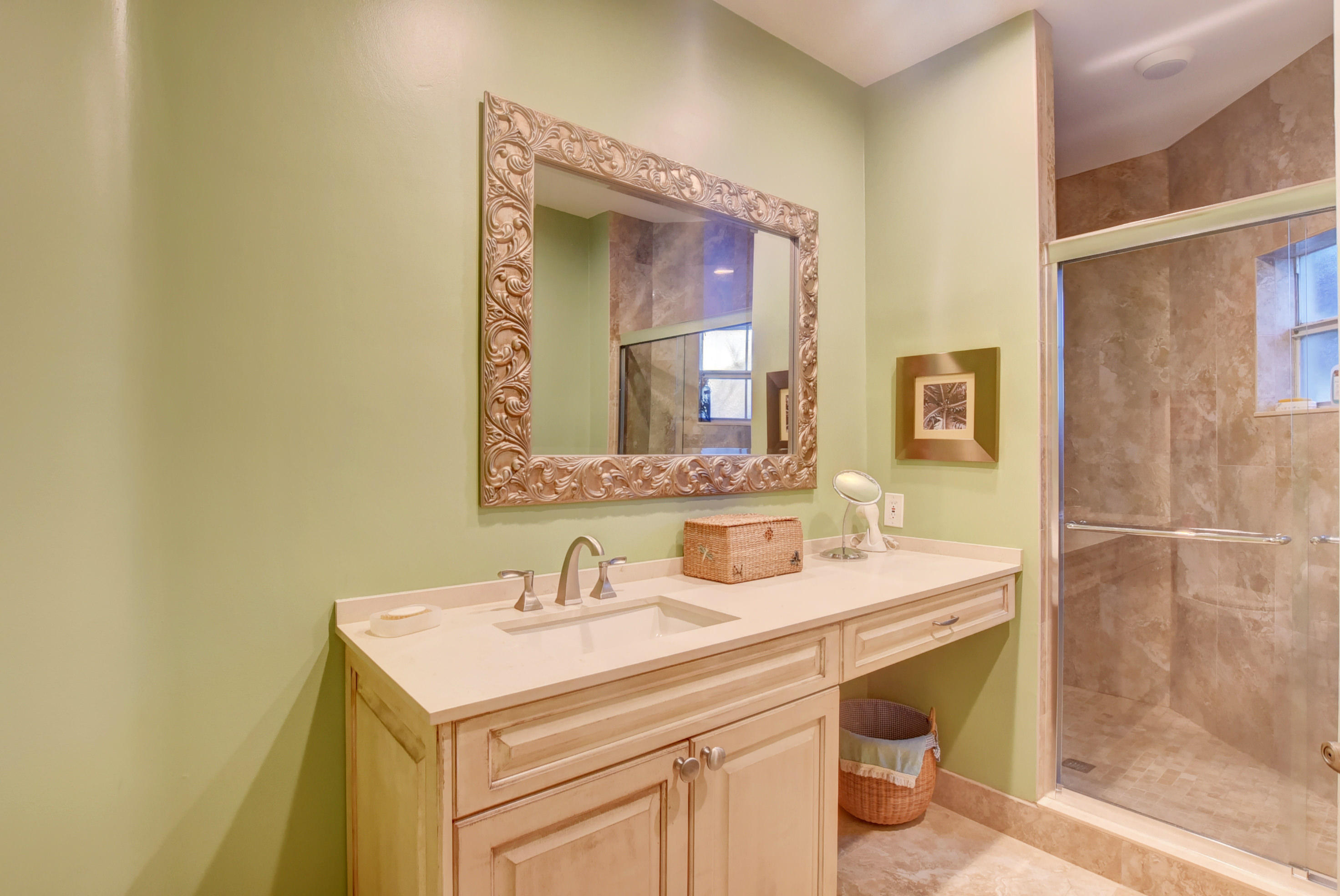 6660 Via Regina Boca Raton, FL 33433 - Photo 20 of 28 a bathroom with a sink and a mirror